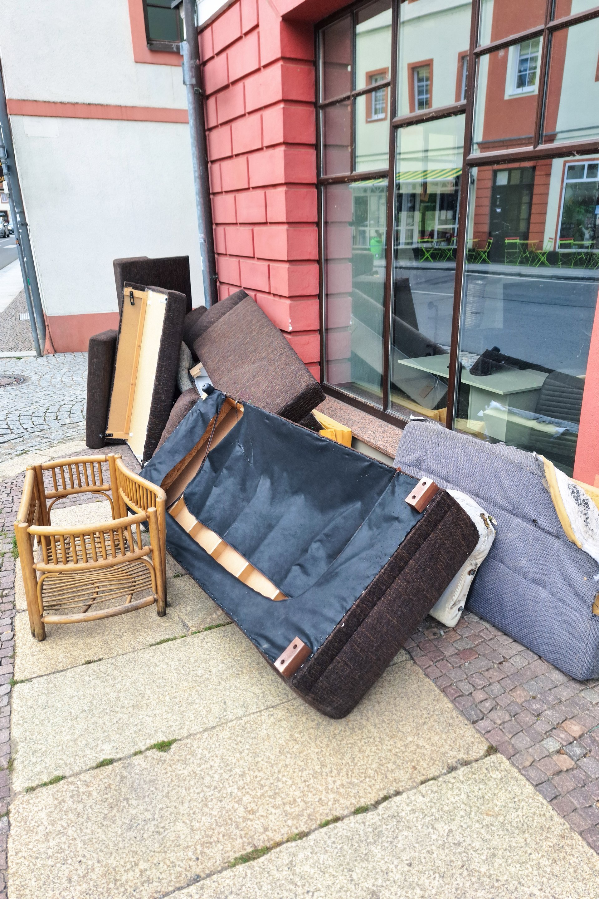 Discarded furniture on city sidewalk